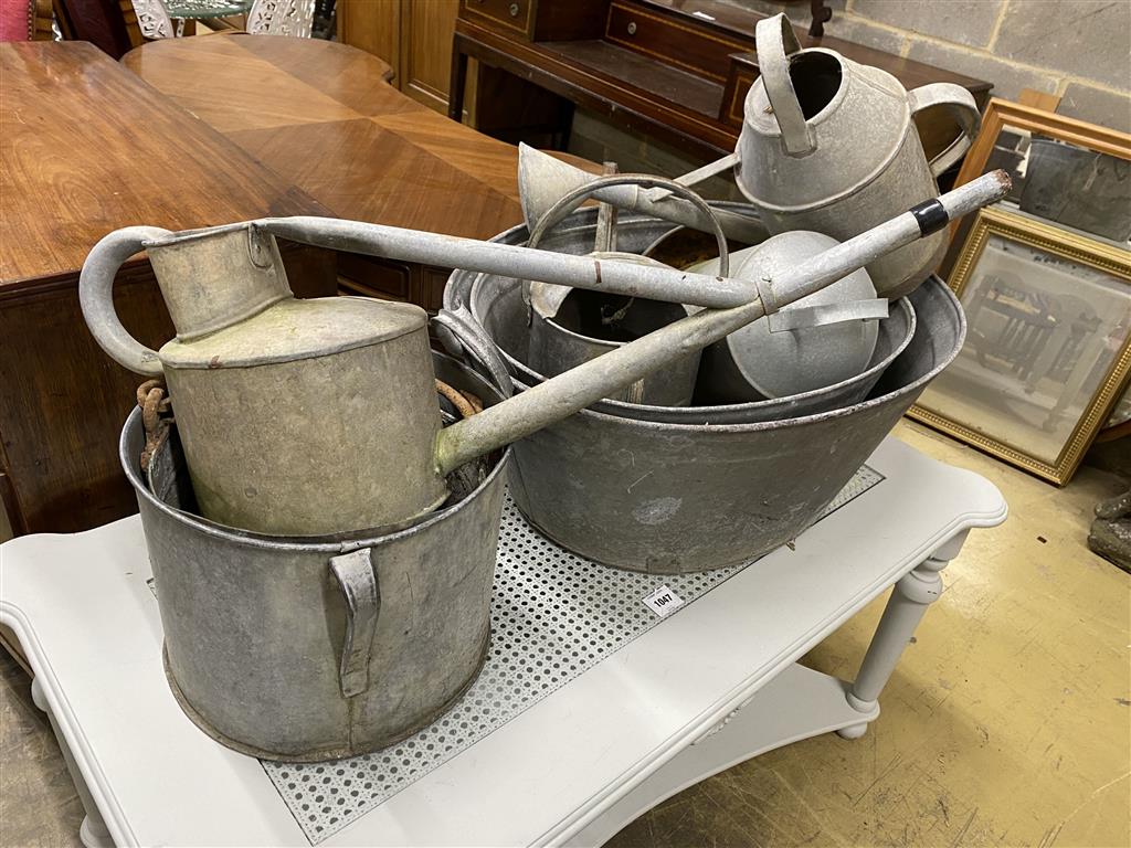 Eight assorted galvanised tubs, feeders and watering cans, largest 80cm, width 56cm